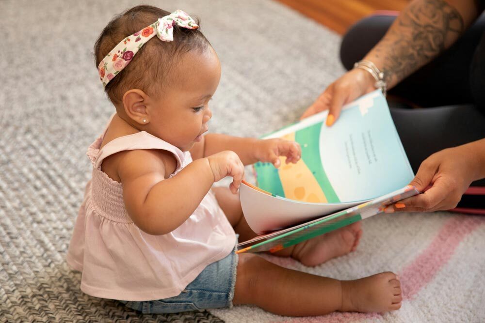 YC nappy 8 X5 PS8t Aqs A unsplash a baby reading a book 8 X5 PS8t Aqs A