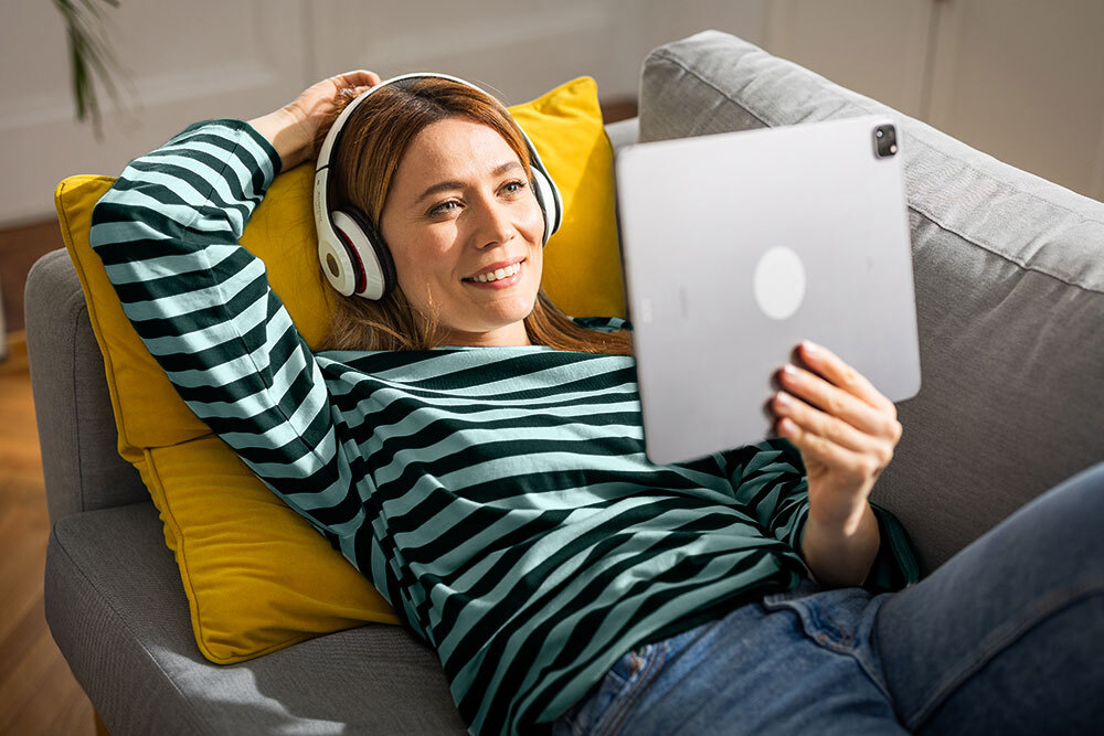 Downloads streaming on couch headphones tablet aquatripes