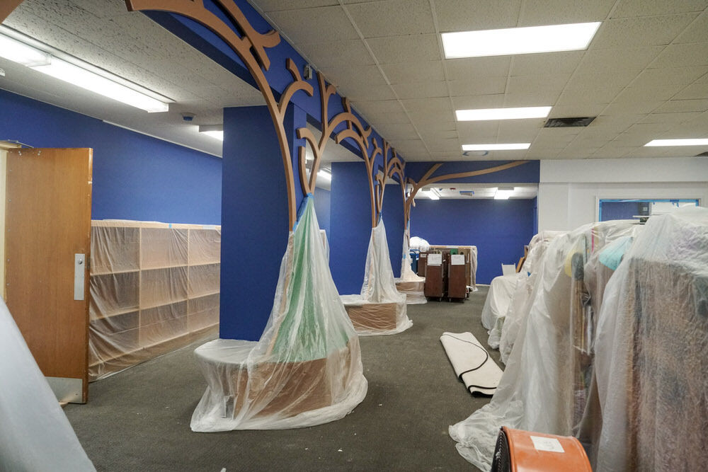 renovations  - Walbrook under construction with new paint, bookshelves, and plastic sheeting