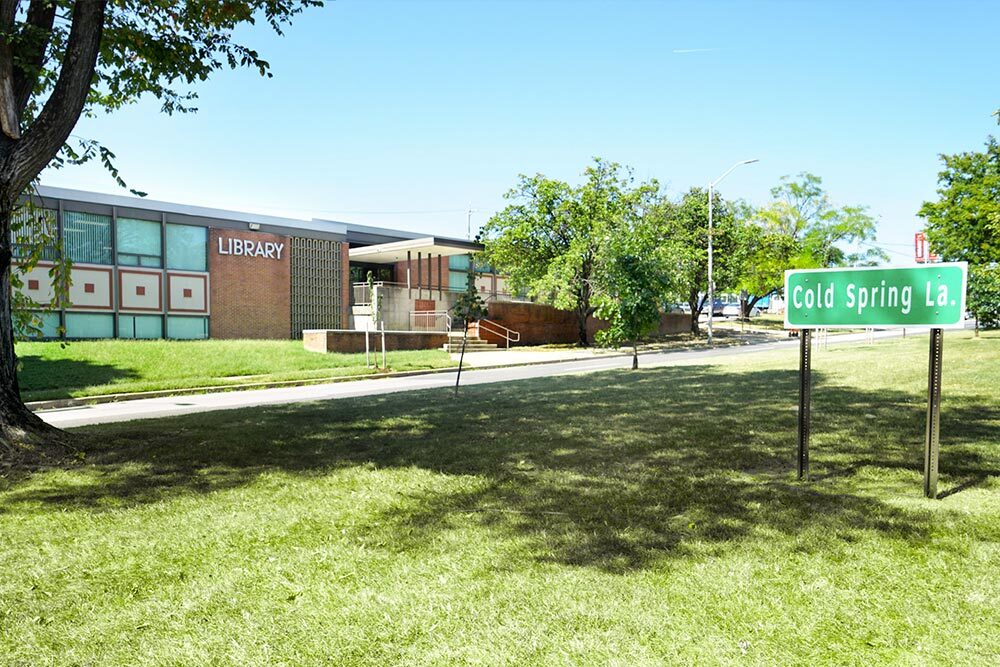 Northwood outside from the grassy median with Cold Spring street sign