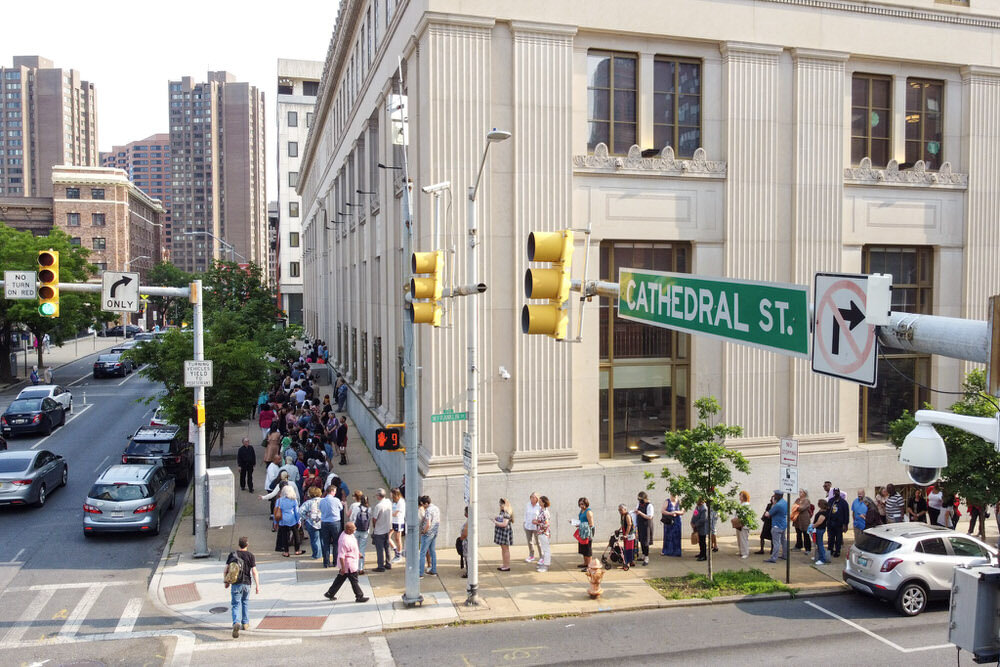 outside Central Library - a crowd lining up on the sidewalks