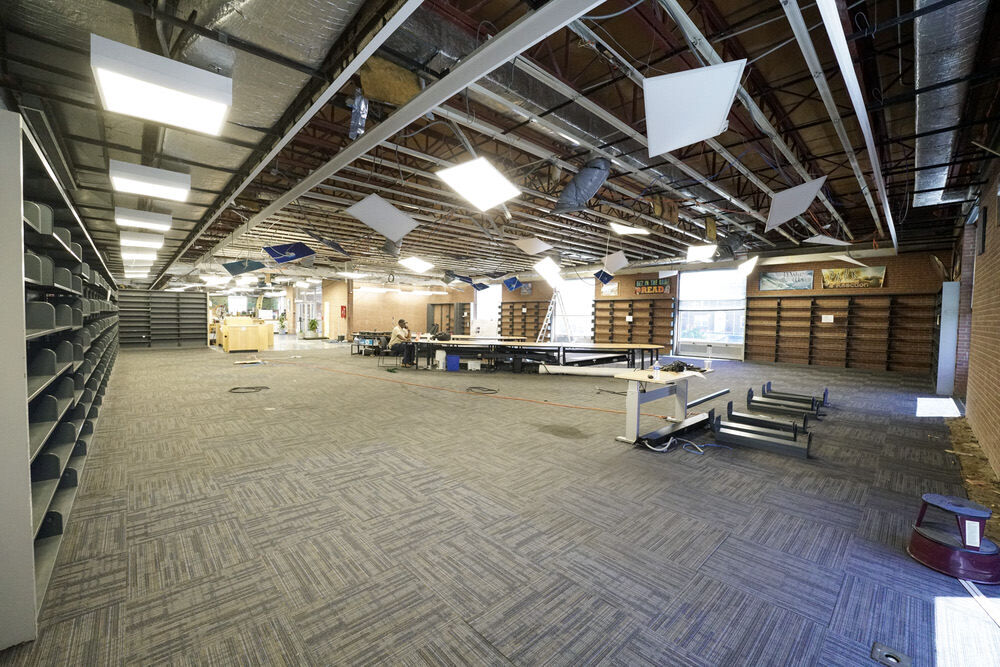 Herring Run Branch closed for renovations - dark interior with empty bookshelves